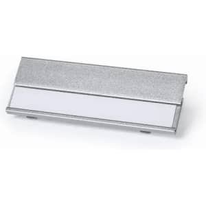 A silver promotional product with a smooth surface and a blank white section. It has a logo on its side.