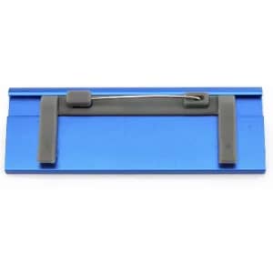 A blue promotional product with a pin back attachment and grey rubber grips along the edges.