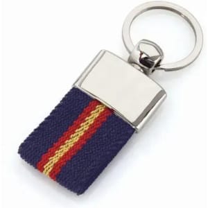 A keyring with a metallic top and a navy blue fabric strap featuring red and yellow stripes.