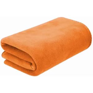 An orange fleece blanket, neatly folded, showcasing a soft texture. The blanket has a smooth, even finish.