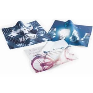 Three cleaning cloths in various designs featuring images of a bike, mechanical elements, and abstract art, with a logo present.