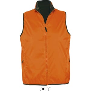 An orange reversible vest featuring a zip front, black inner lining, and side pockets. It includes a logo.