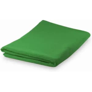 A green folded blanket placed neatly on a flat surface.