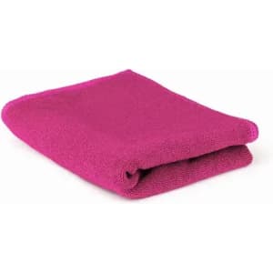 A folded towel in a vibrant fuchsia colour, showcasing a soft texture.