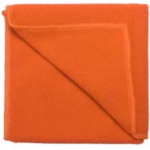 An orange towel neatly folded, featuring a soft texture and a simple design.