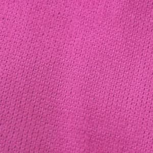 A textured pink gym towel featuring a woven pattern and a branding logo.