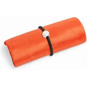 An orange, rolled-up product secured with a black band, featuring a circular metallic closure.