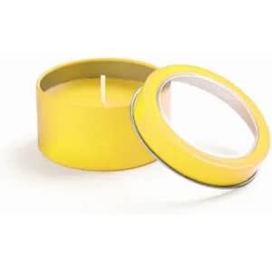 A yellow candle in a round tin container with a removable lid. The candle wick is visible inside.