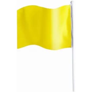 A yellow flag on a white pole, waving gently in a breeze.