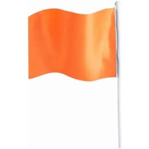 An orange flag on a white pole, billowing gently in the breeze.