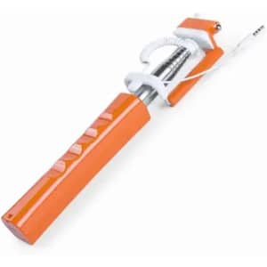 A selfie stick in orange and white, featuring a pull-out extendable arm and a connector for a smartphone.