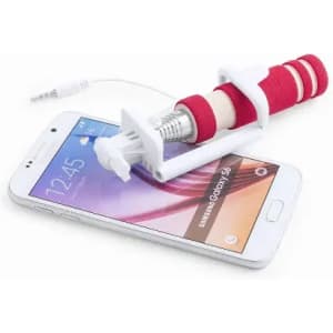 A smartphone with a white and red selfie stick attached, featuring a logo. The phone display is visible.