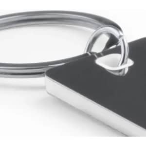 A keyring with a sleek silver metal loop and a rectangular black tag attached.