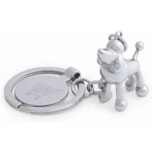 A silver keychain featuring a dog figure, attached to a circular ring with a shopping cart emblem.