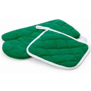 A set of green quilted oven mitts and a pot holder, featuring white trim.