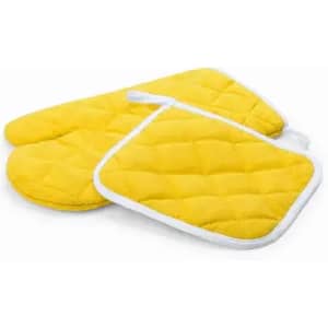 Bright yellow oven mitts and a pot holder, featuring a quilted design and white edging.