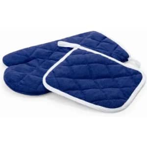 A set of navy blue oven mitts and a pot holder, featuring a quilted design and white trim.