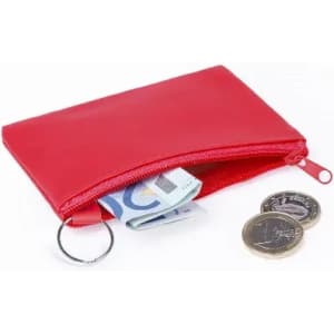 A red zippered pouch containing banknotes and coins, with a keyring attached.
