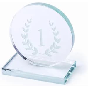A clear glass award featuring a laurel wreath design and the number one prominently displayed.