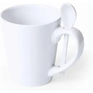 A white mug with a unique handle design and a spoon attached to the side.