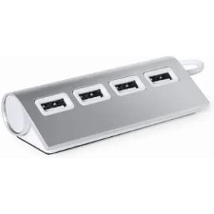 A USB hub with four ports, featuring a sleek silver design and a curved shape. It has a minimalistic branding logo.
