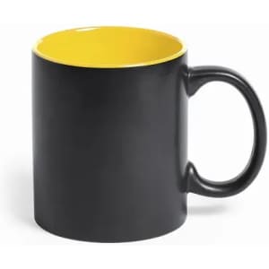 A drink bottle featuring a black exterior and a bright yellow interior, with a curved handle and a smooth surface.