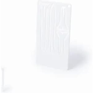 A white product featuring various grooves and a small tool on the side, possibly for shaping or crafting.