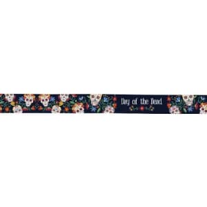 A decorative ribbon featuring colourful skulls and floral designs, with a dark background and text.