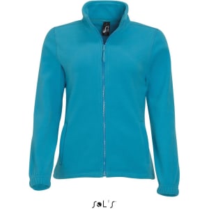 A women's zippered fleece top in bright blue, featuring a high collar and elastic cuffs. It has a logo on the tag.