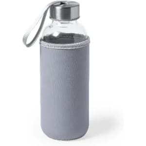 A drink bottle with a transparent glass body, grey fabric sleeve, and a metal cap with a carrying strap.