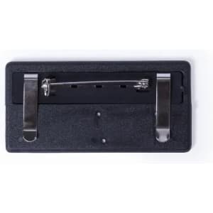 A black pin backing with a metal clasp and two prongs for securing items.