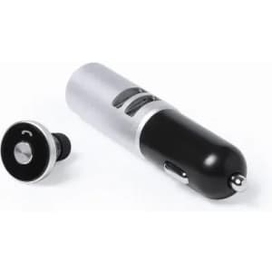 A black and silver car charger with a removable USB port and a circular connector. It features a logo on the body.