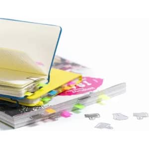 A stack of colourful notepads with sticky tabs and paper clips scattered on a table.