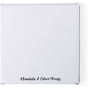 A square white book with a black logo and text that reads "Mandala & Colour Therapy" on the cover.