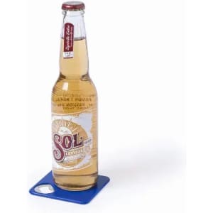 A drink bottle with a golden, clear beverage and a white label featuring a logo, set on a blue coaster.