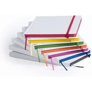 A stack of notebooks in various colours with elastic bands, featuring plain covers and ribbon page markers.