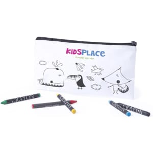 A pencil case in white with black doodles, accompanied by four colourful crayons in green, yellow, red, and black.