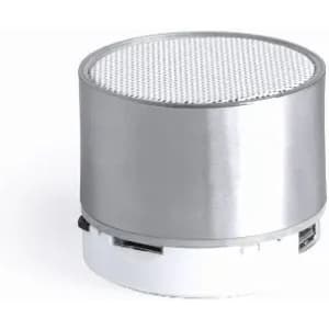 A silver and white speaker with a circular mesh top and a compact design, featuring a branding logo.