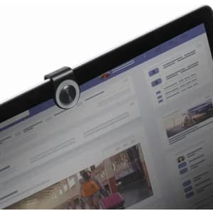 A webcam attachment in black mounted on the top of a laptop screen, showcasing a desktop interface.