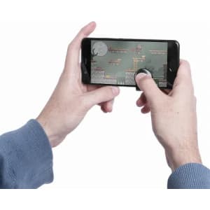 A person’s hands holding a smartphone displaying a gaming app on the screen. The phone has a black casing.
