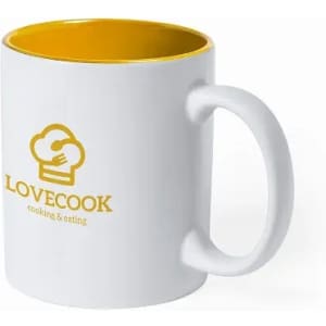 A white mug with a yellow interior and a logo on the front. The handle is curved and suitable for holding.