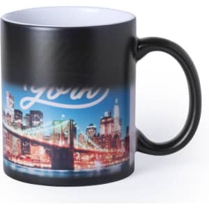 A black mug featuring a vibrant cityscape of New York with a bridge and skyline design.