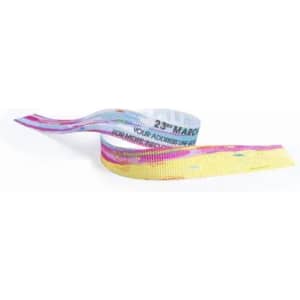 A colourful event wristband featuring a mix of pastel pink, blue, and yellow patterns, with branding included.
