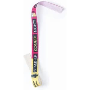 A fabric wristband featuring multicoloured patterns and text related to a stand-up comedy event, with a branding logo.