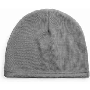 A grey beanie made of soft fabric, featuring a simple, seamless design. It has a small logo on one side.