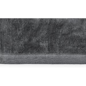 A grey towel with a plush texture and a stitched hem at the bottom.