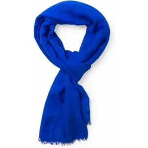 A blue scarf with a soft texture and fringed edges, elegantly draped in a loop.