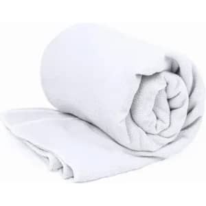 A rolled white towel resting on a flat surface. The towel has a soft texture and appears fluffy.