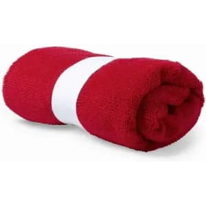 A rolled red towel secured with a white band, displaying a soft, textured surface.