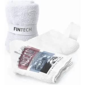 A set of white towels with one featuring a graphic design and a branded label.